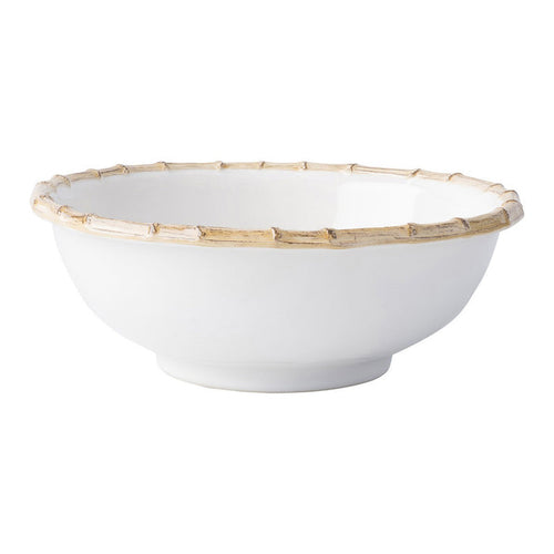 White ceramic serving bowl with natural bamboo rim and smooth finish.