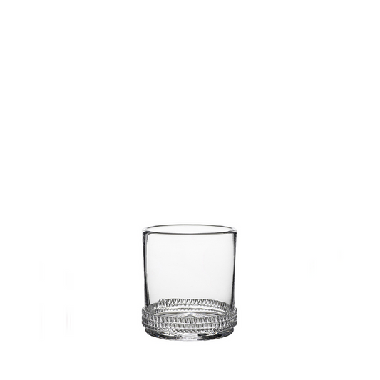 Clear Dean Old Fashioned glass with thick base and textured concentric circle design.