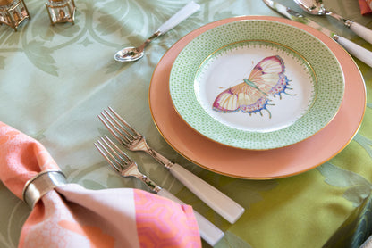 Green apple lace pattern cocktail plate with butterfly accent on white center.