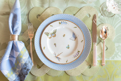 White dinner plate with cornflower blue lace border and hand-painted butterflies and flowers.