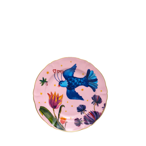 Round pink dessert plate with gold rim, blue bird, and colorful floral design.