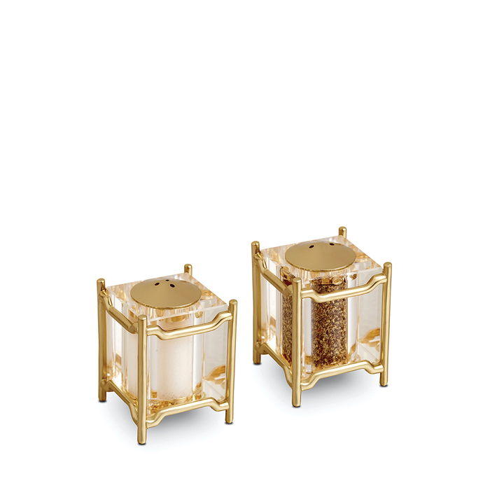 Gold framed New York diner style salt and pepper shakers with clear glass holders.