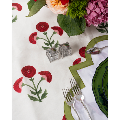 Platinum New York Diner salt and pepper shakers with clear glass bodies and silver tops on embroidered floral tablecloth.