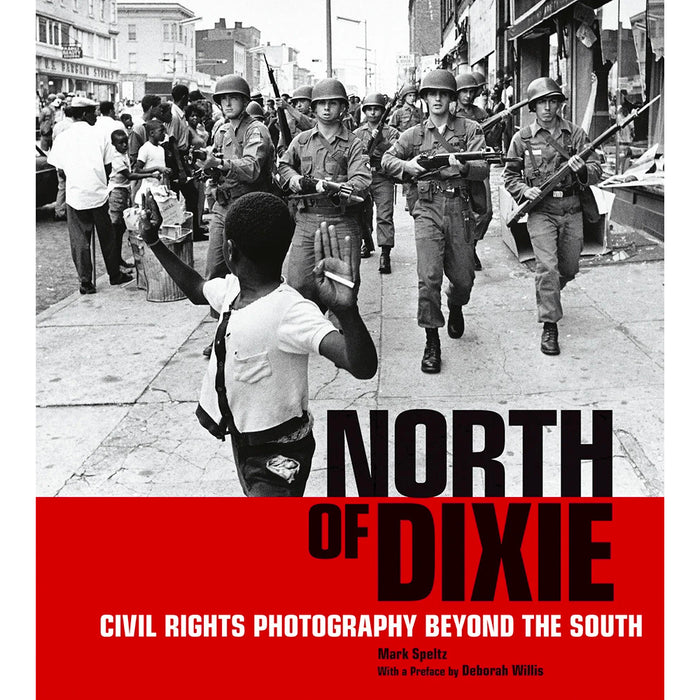 Book cover of 'North of Dixie: Civil Rights Photography Beyond the South' featuring a black and white photograph of a child walking in front of armed guards, with a red band across the bottom of the cover.