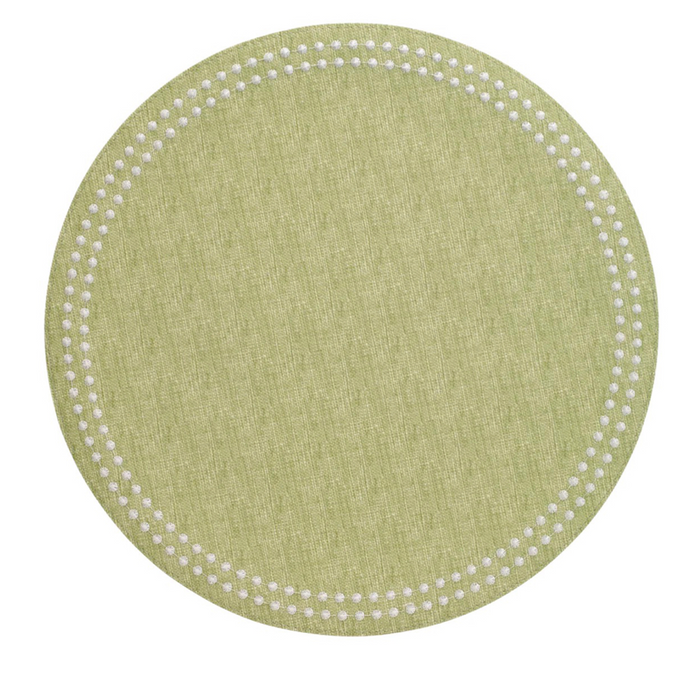 Round grass-green placemat with textured fabric and a border of small white dots.