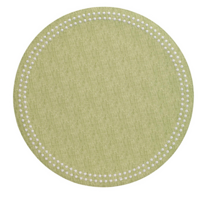 Round grass-green placemat with textured fabric and a border of small white dots.