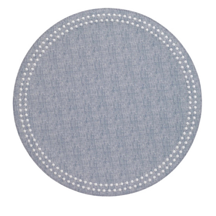 Round blue placemat with textured fabric and decorative perforated dot border.