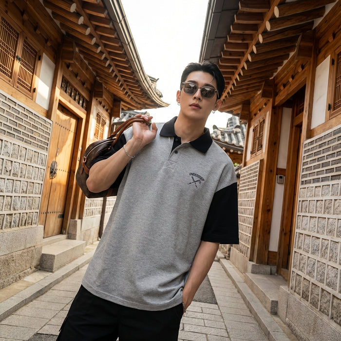 Polo oversize bicolore vert et gris avec col brodé. Style streetwear K-fashion.