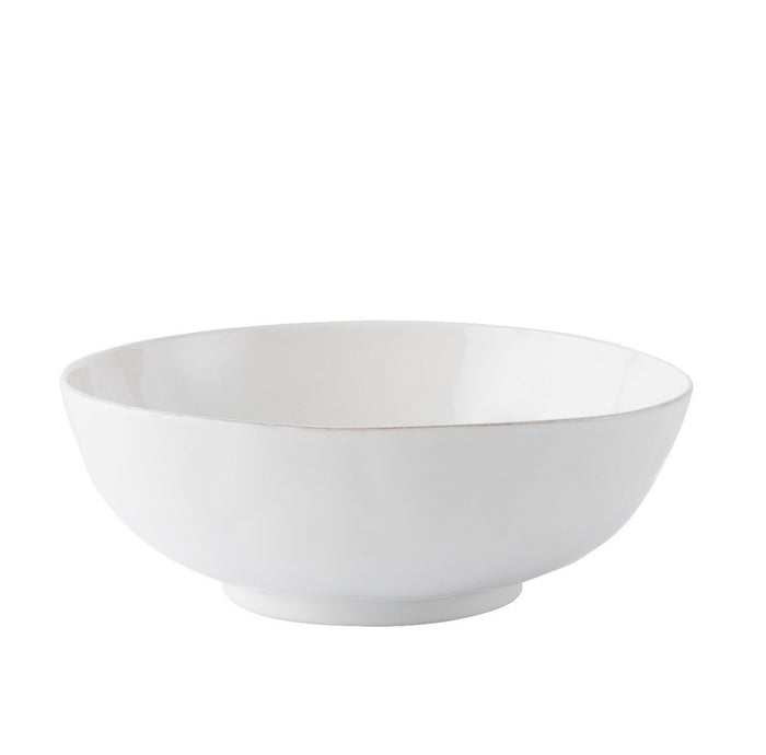 Whitewashed ceramic serving bowl with smooth, slightly textured matte finish and rounded edges.