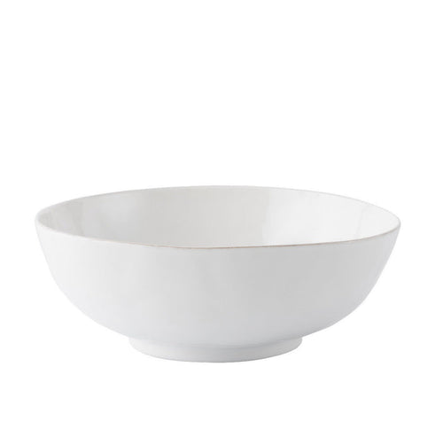 Whitewashed ceramic serving bowl with smooth, slightly textured matte finish and rounded edges.