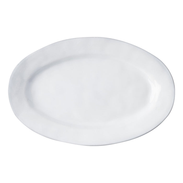 Large white oval ceramic serving platter with subtle textured rim and smooth finish.