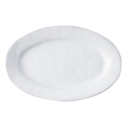 Large white oval ceramic serving platter with subtle textured rim and smooth finish.