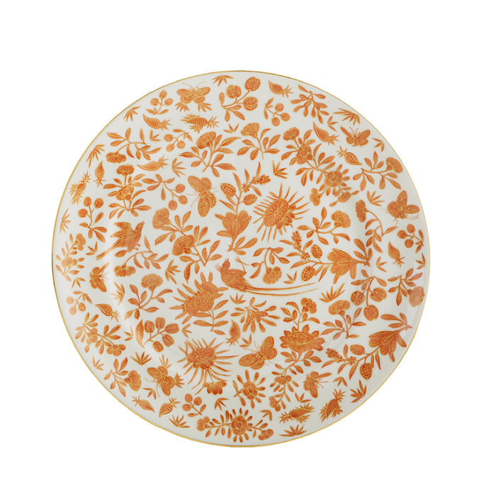 White dinner plate with intricate orange floral and butterfly pattern and gold rim.