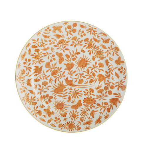White dinner plate with intricate orange floral and butterfly pattern and gold rim.