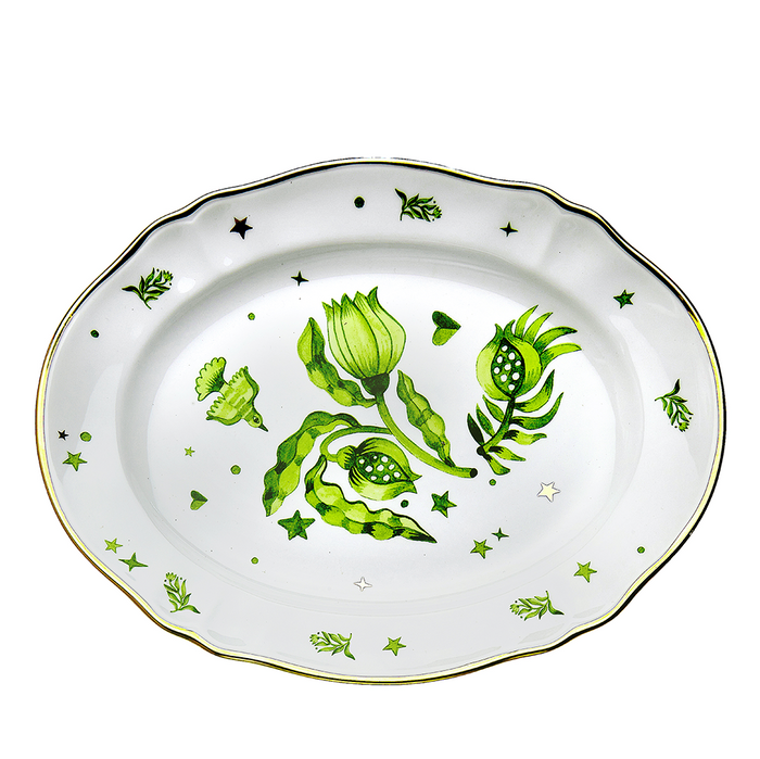 White ceramic platter with scalloped edges, green botanical and star motifs, gold trim detail.