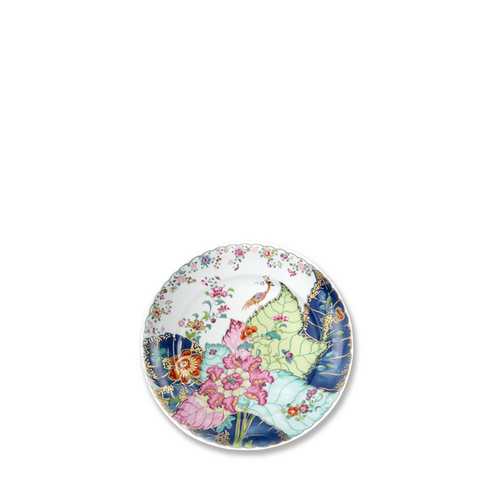 Round bread and butter plate with colorful tobacco leaf and floral design on white background.